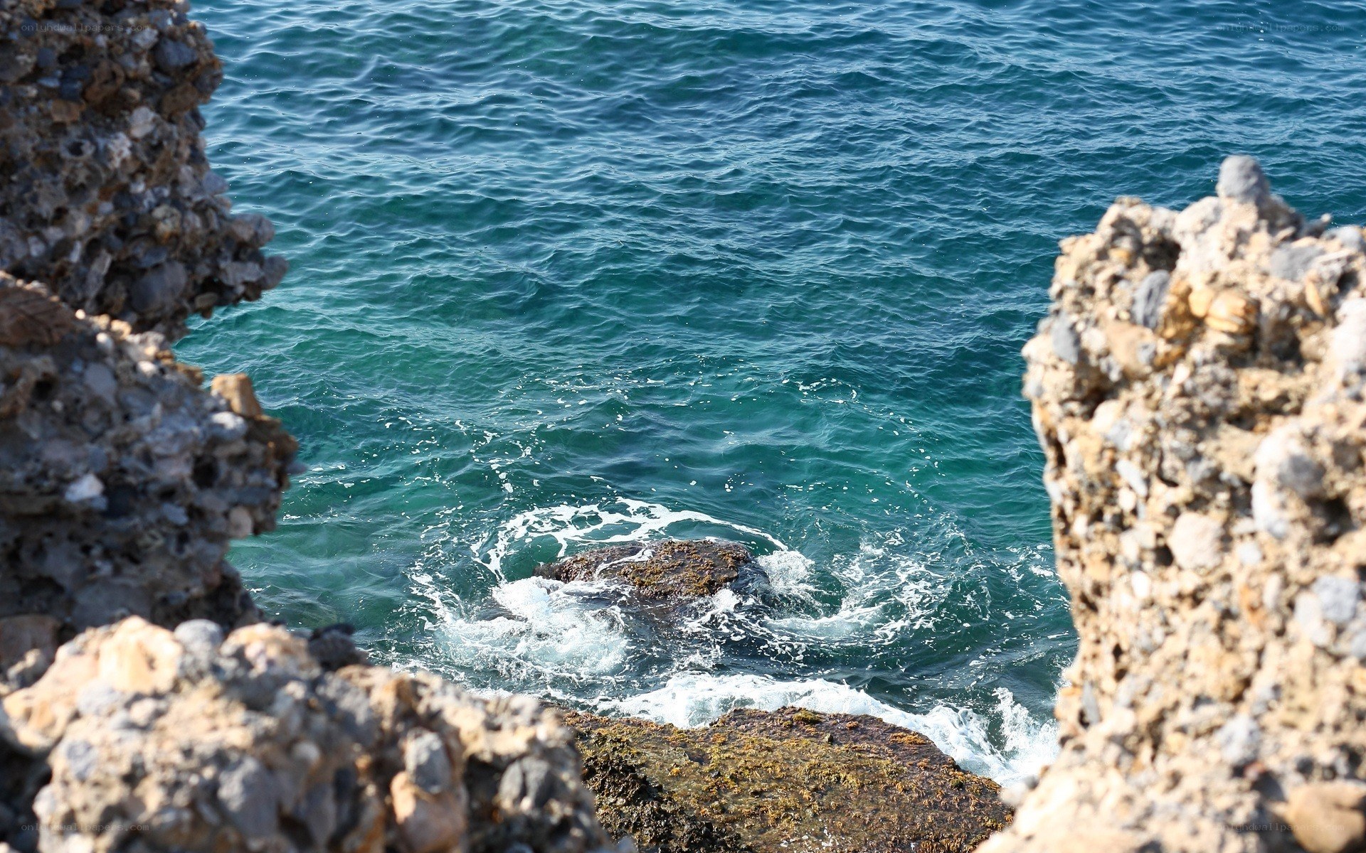 ocean waves crashing on rocks