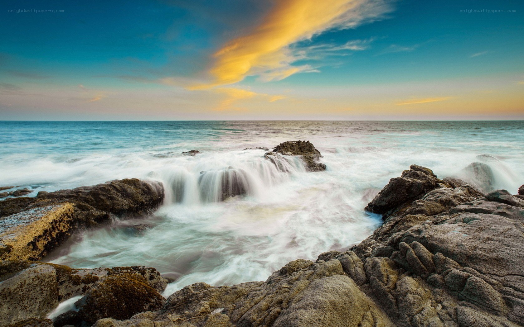 Ocean waves crashing on rocks