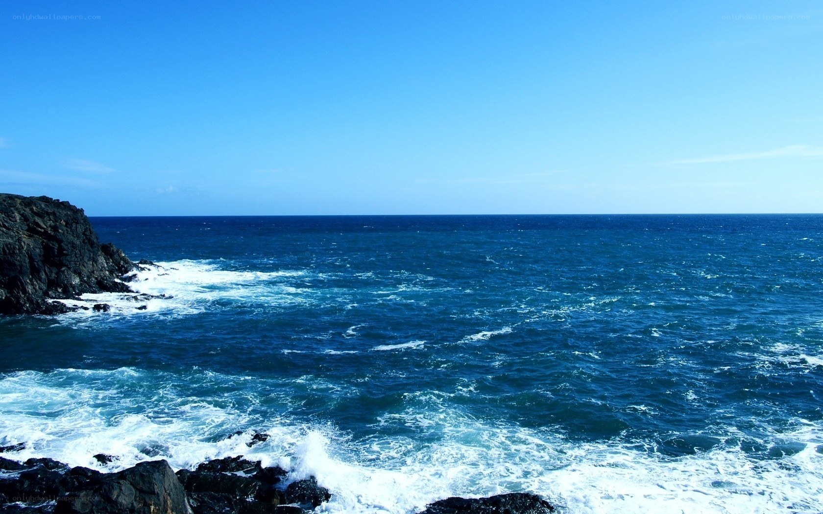 Ocean waves crashing on rocks