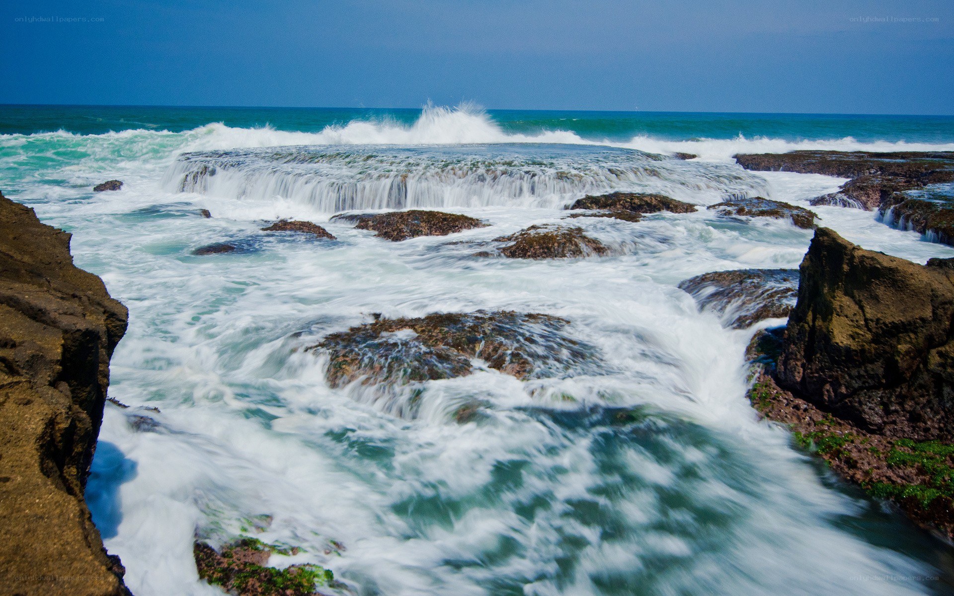 Ocean waves crashing on rocks