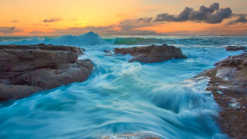 Ocean Waves Crashing on Rocks — Blue, Sunset
