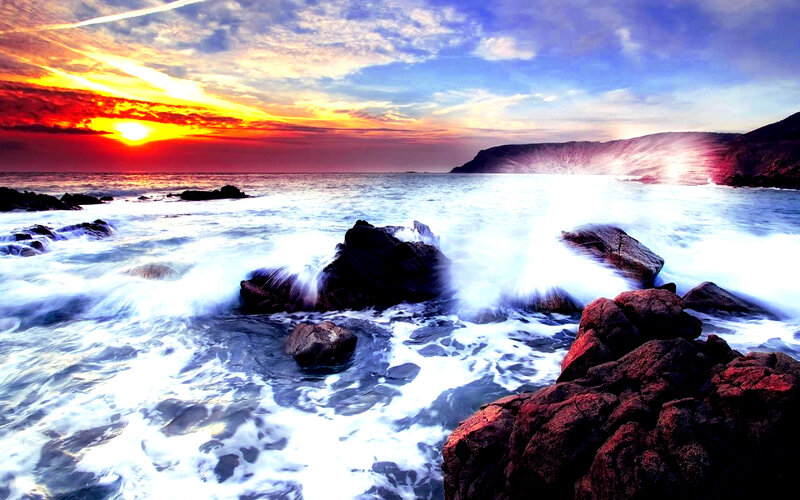 Ocean Waves Crashing on Rocks — Red