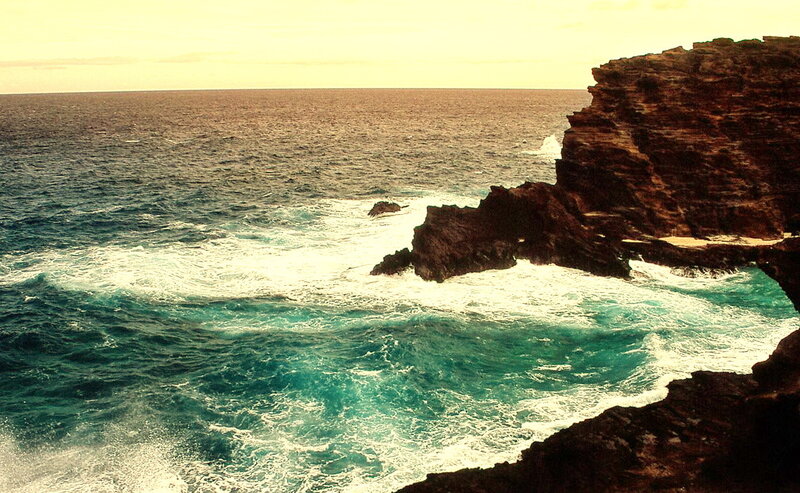 Ocean waves crashing on rocky cliffs
