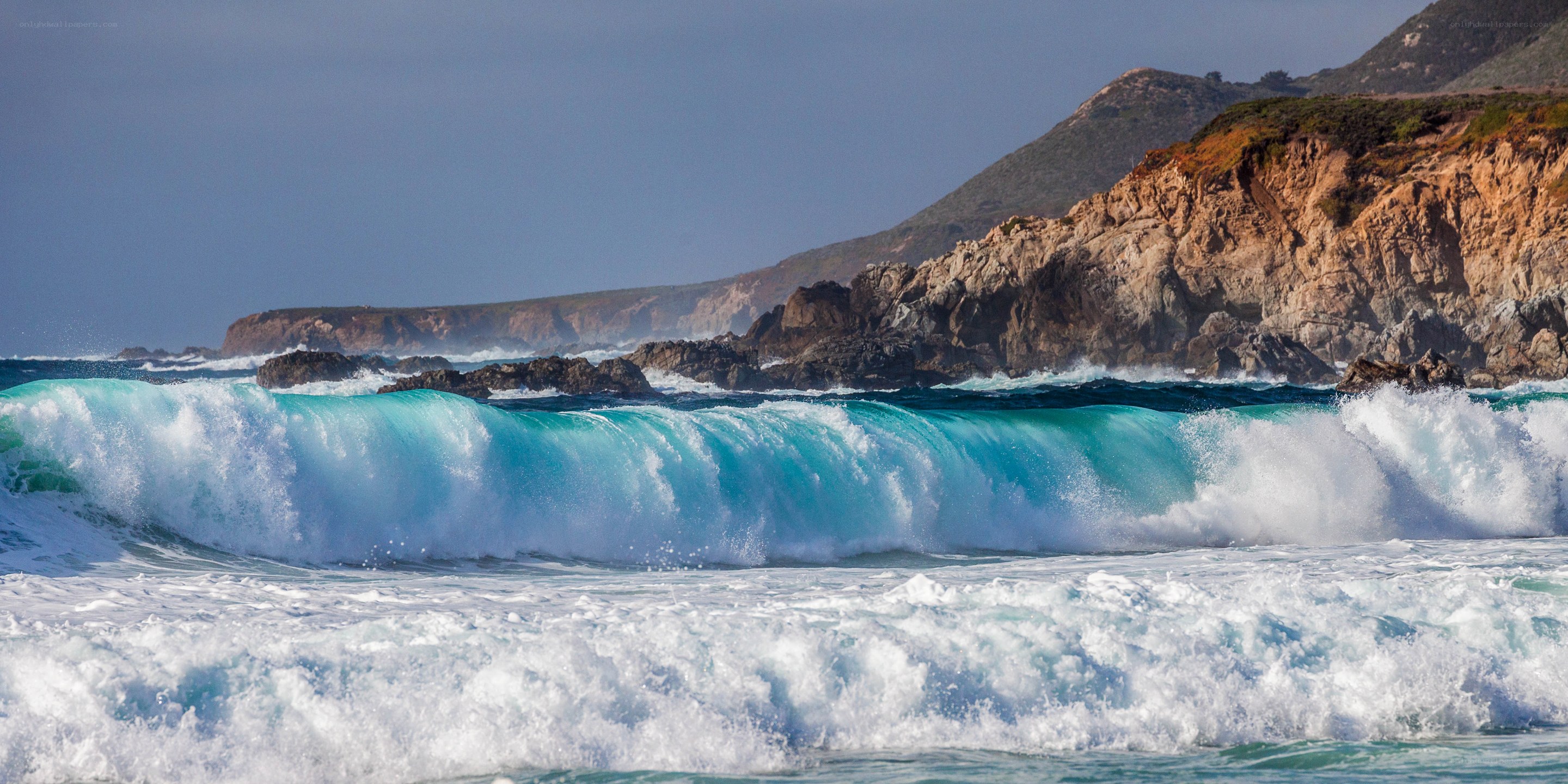 Ocean waves crashing on rocky coast