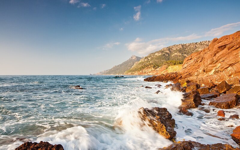 Ocean waves crashing on rocky shore