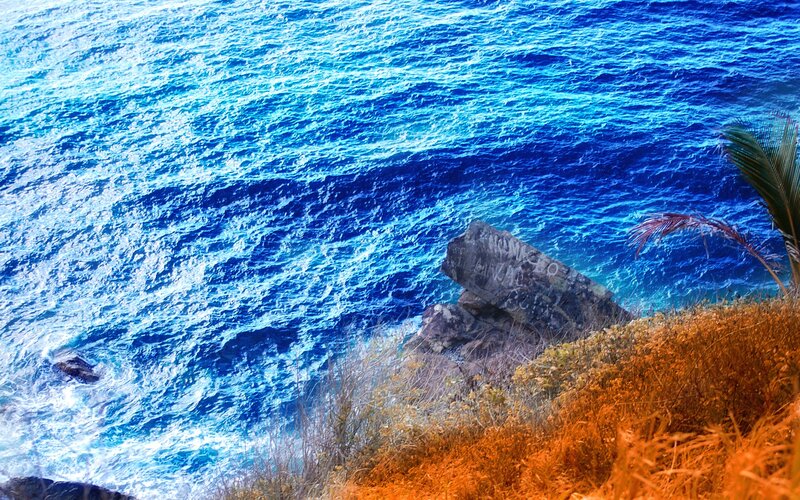 Ocean waves crashing on rocky shore