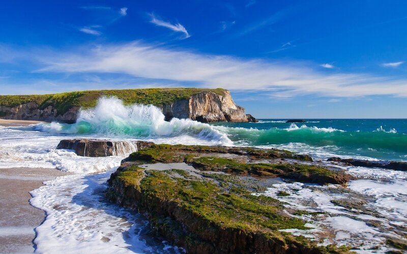 Ocean waves crashing on rocky shore