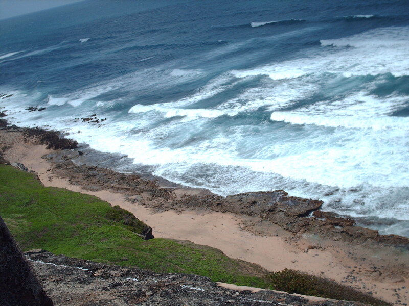ocean waves crashing on rocky shore