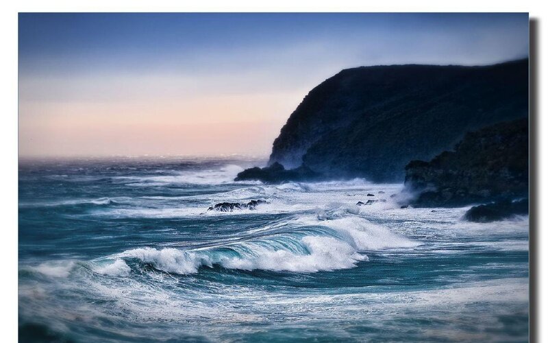 Ocean waves crashing on rocky shore