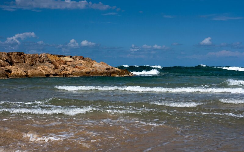 Ocean waves crashing on rocky shore