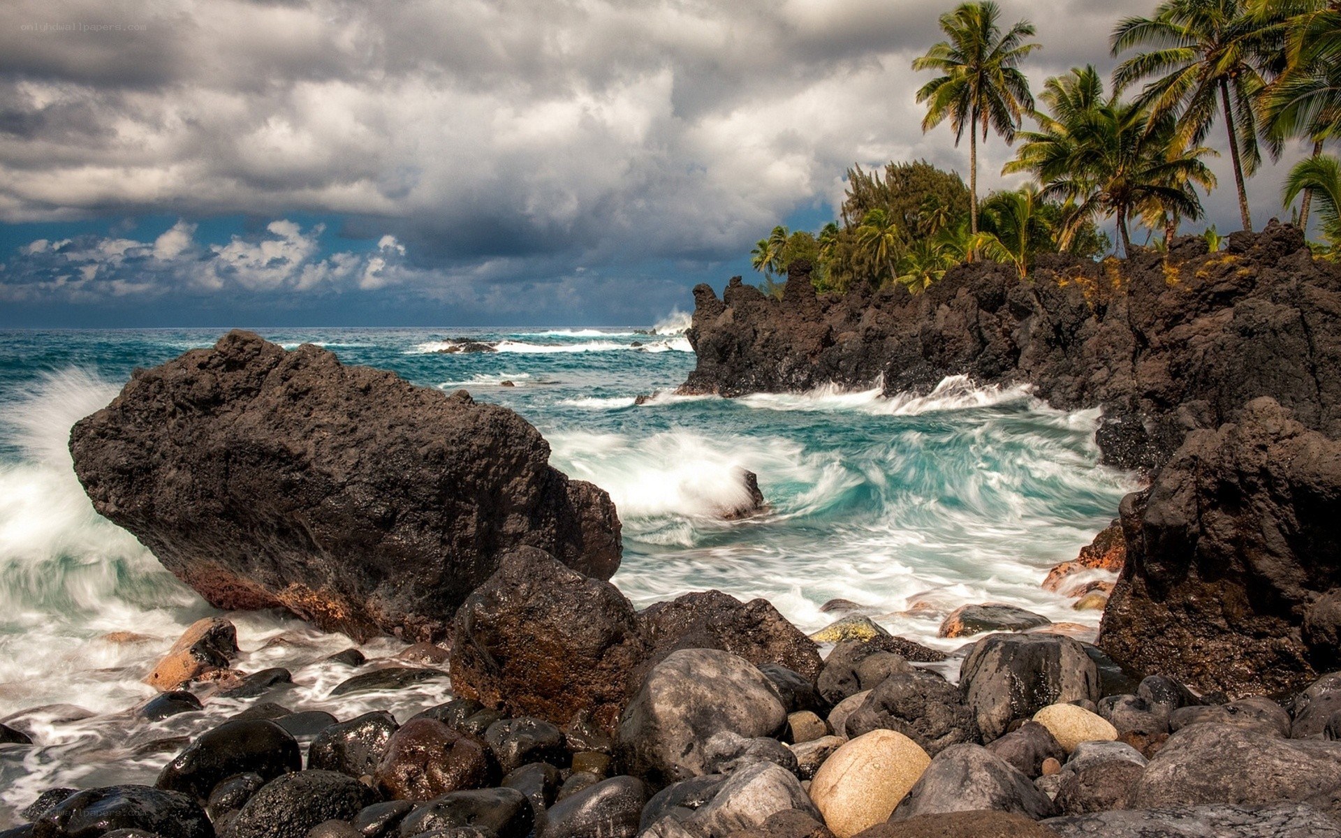 Ocean waves crashing on volcanic rocks