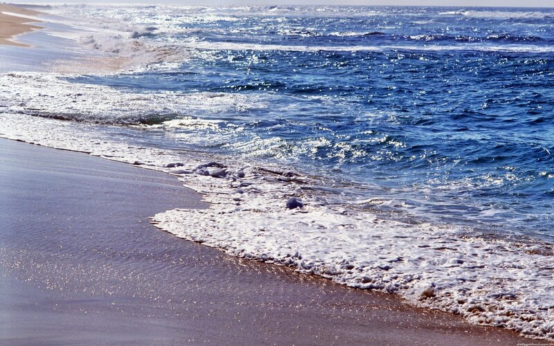 Ocean waves on a sandy beach