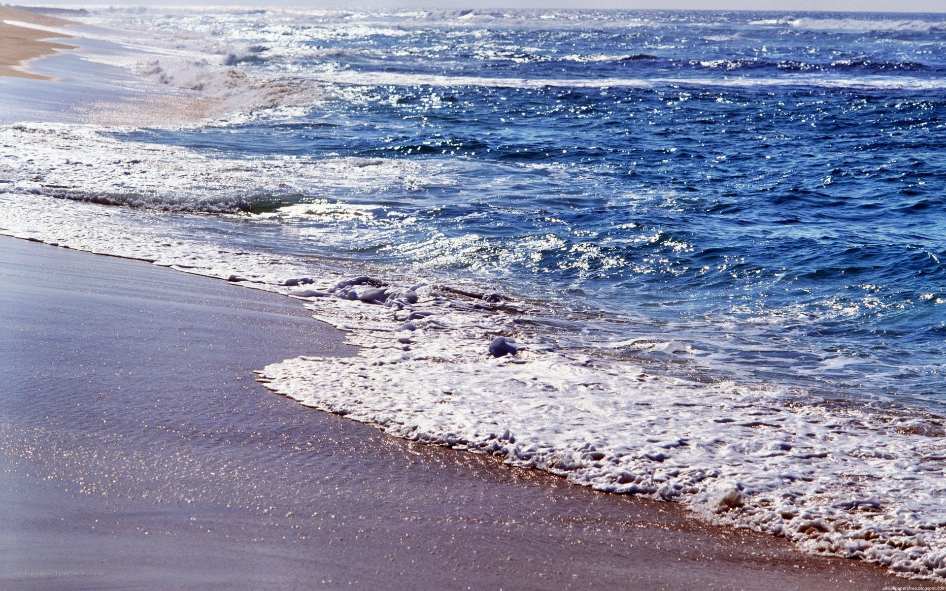 Ocean waves on a sandy beach