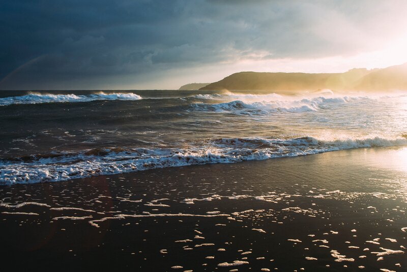 Ocean Waves on Beach — Blue, Dramatic, Sunset, Photograph, Clouds, Cliff