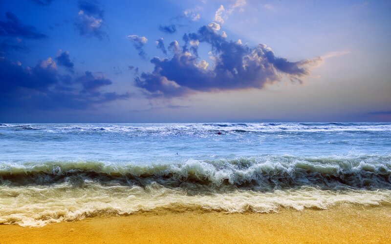 Ocean Waves on Beach — Blue, Dramatic, Sunset, Photograph, Clouds, Sand, Person