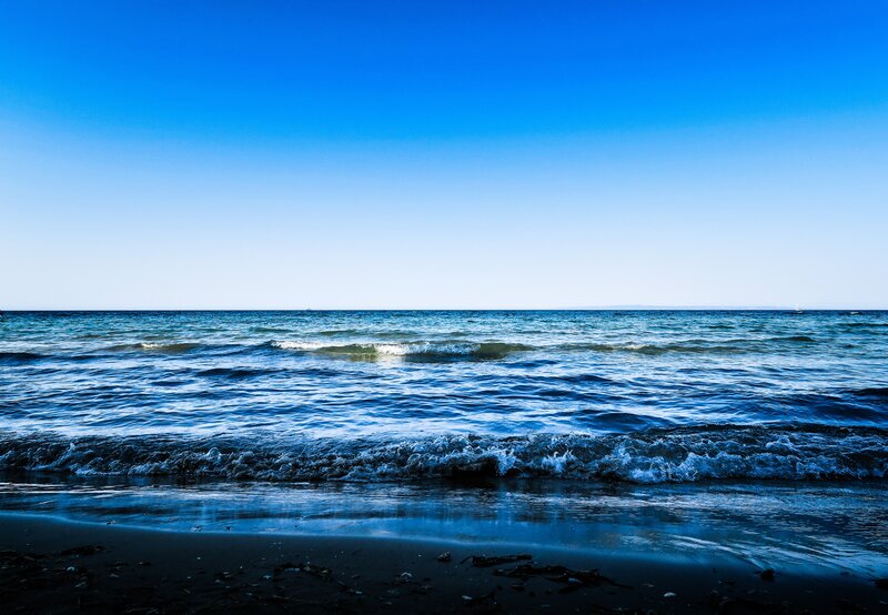 Ocean Waves on Beach — Blue, Serene, Afternoon, Photograph, Sand, Sky, Seaweed