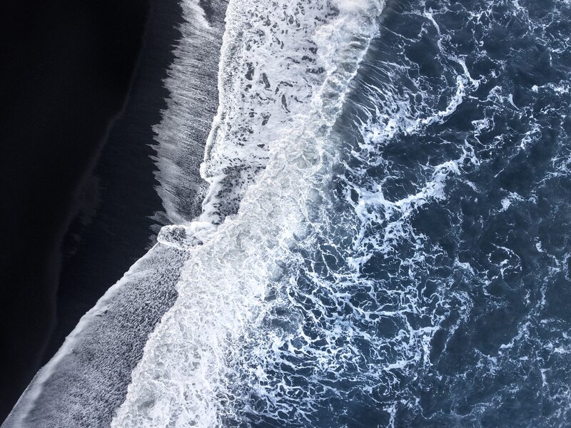 Ocean Waves on Black Sand — Blue