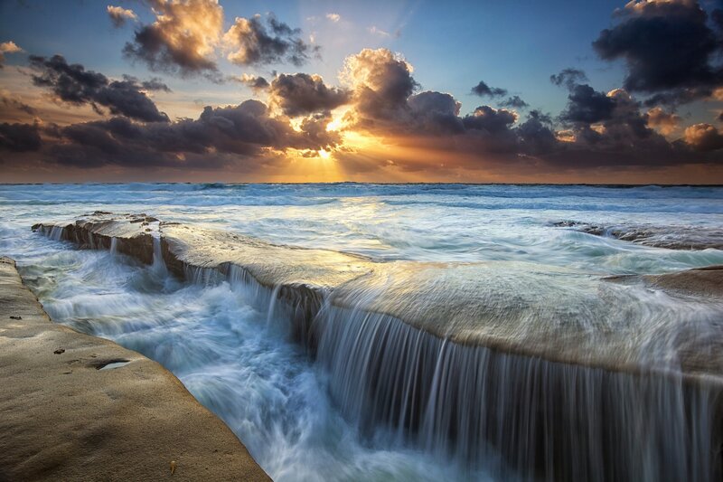 Ocean Waves on Rocks — Blue, Dramatic, Sunset, Photograph, Clouds, Sunlight, Sea