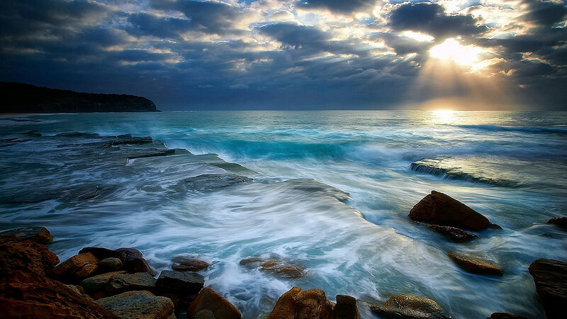 Ocean Waves on Rocks — Blue, Dramatic, Sunset, Photograph, Clouds, Sunlight