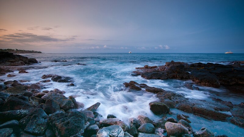 Ocean Waves on Rocks — Blue, Serene, Sunset, Photograph, Boats, Sky, Gray, White