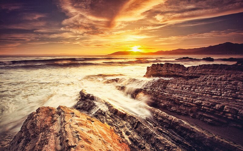 Ocean Waves on Rocks — Orange, Dramatic, Sunset, Photograph, Sun, Mountains, Clouds