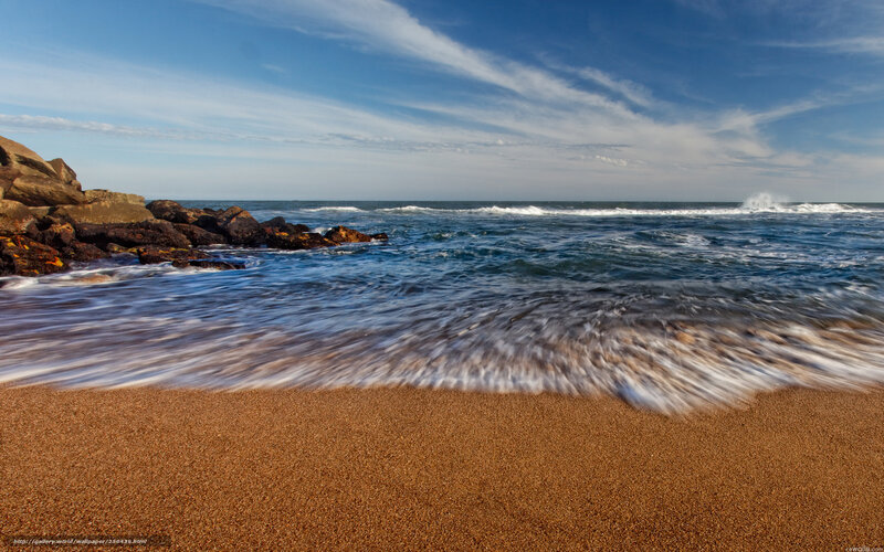 Ocean waves on sandy beach