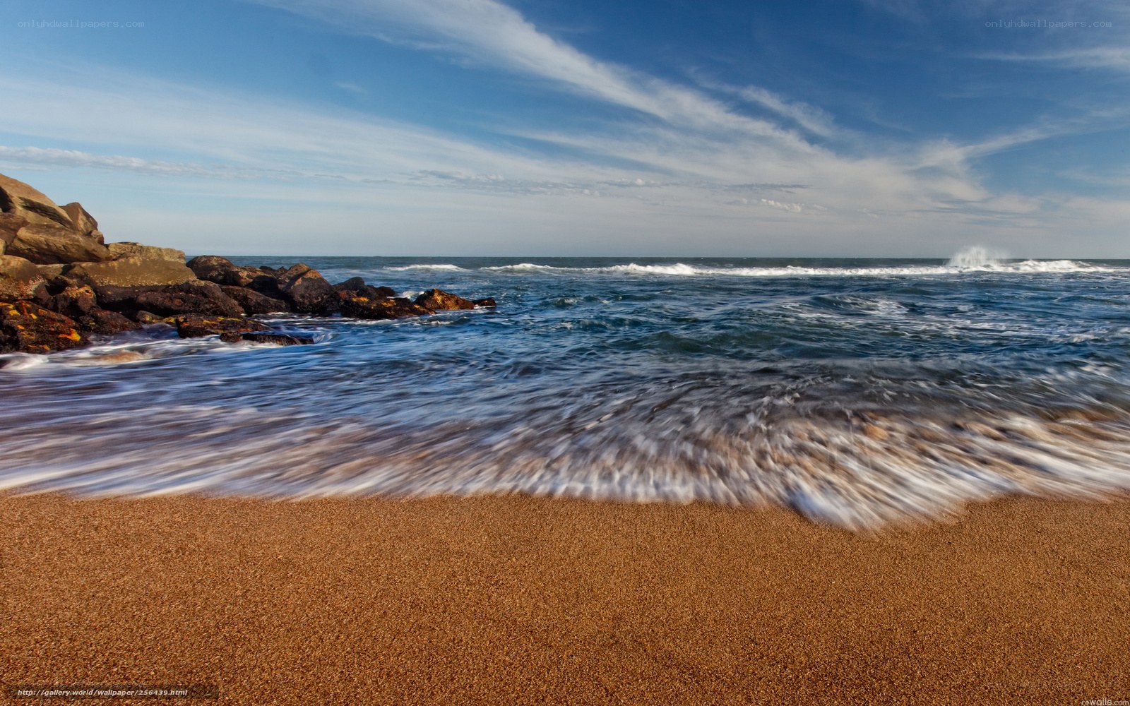 Ocean waves on sandy beach