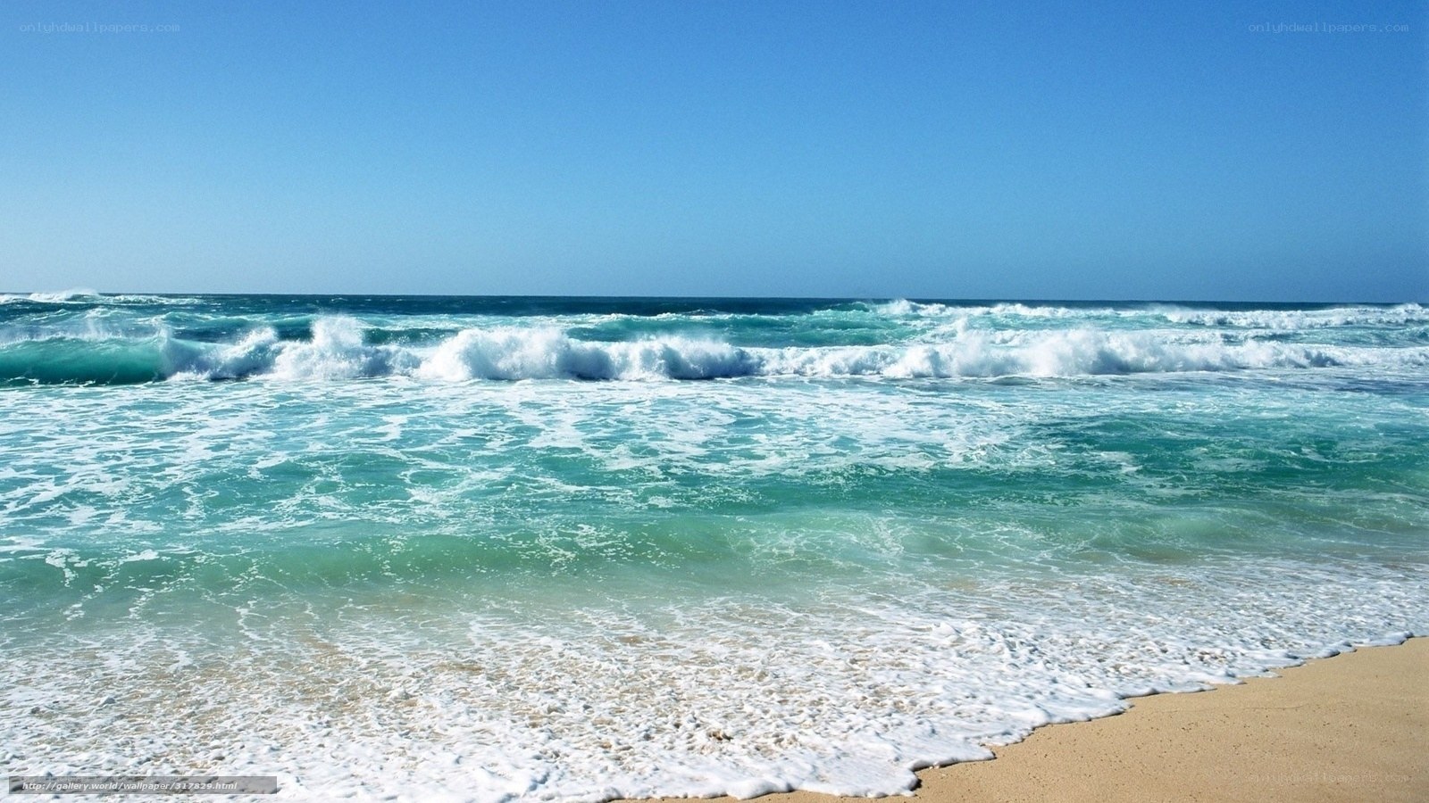 Ocean waves on sandy beach