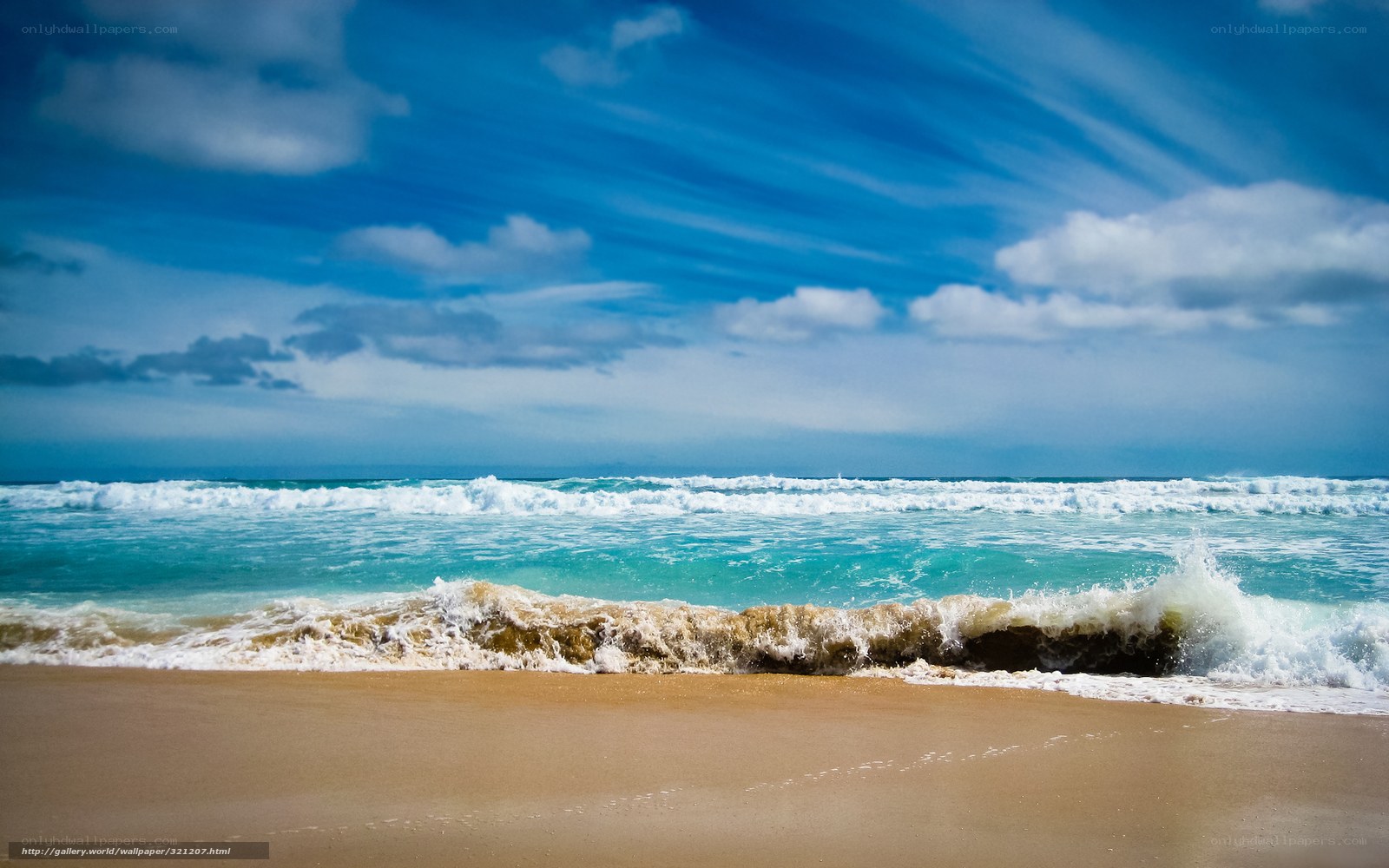 Ocean waves on sandy beach