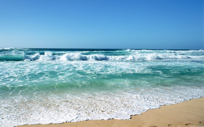 Ocean waves on sandy beach