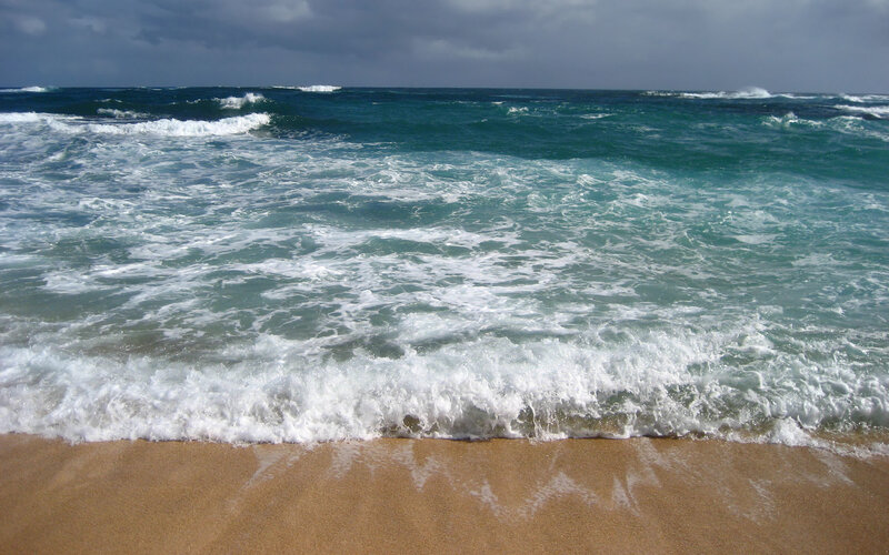 Ocean waves on sandy beach