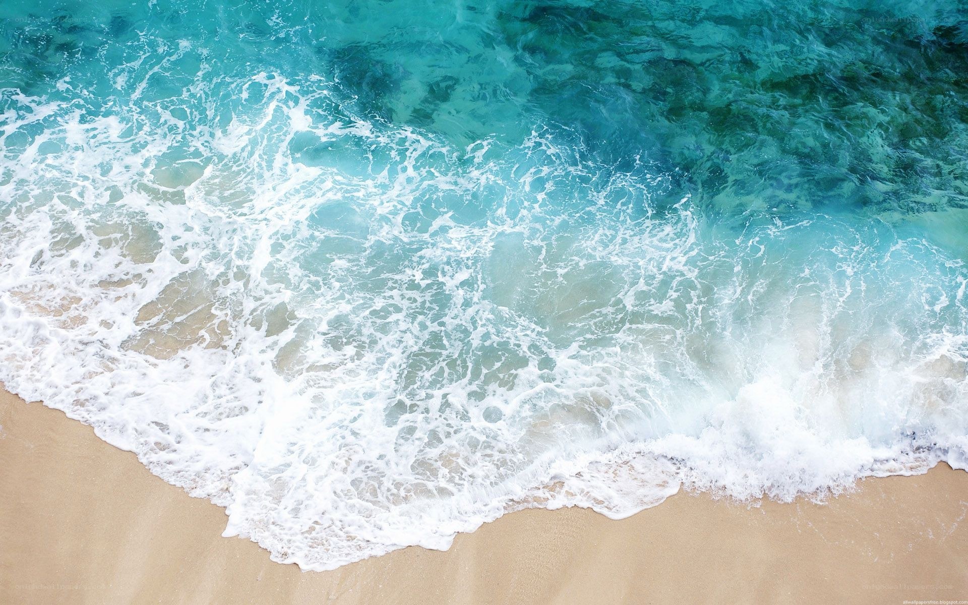 Ocean waves on sandy beach