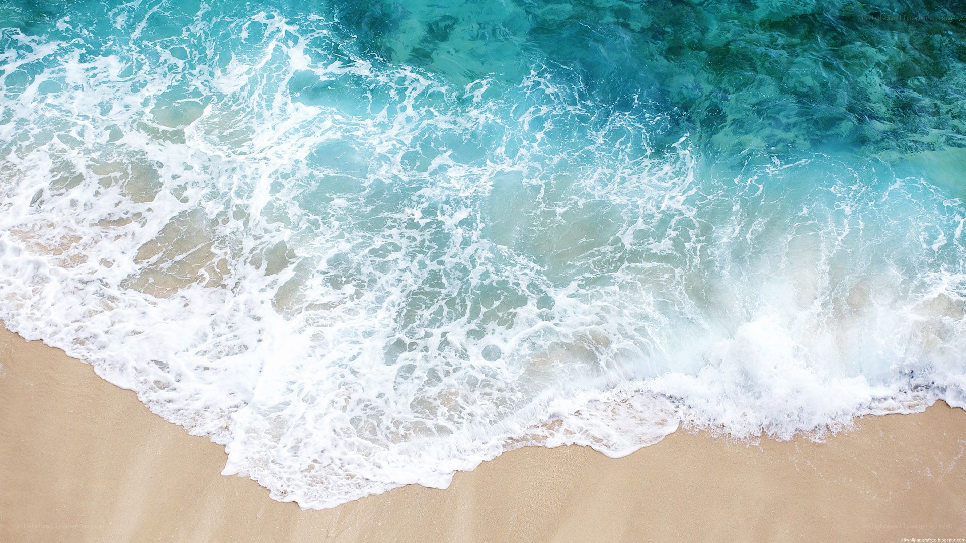 ocean waves on sandy beach