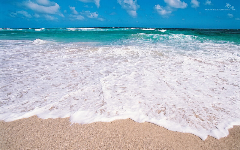 Ocean waves on sandy beach