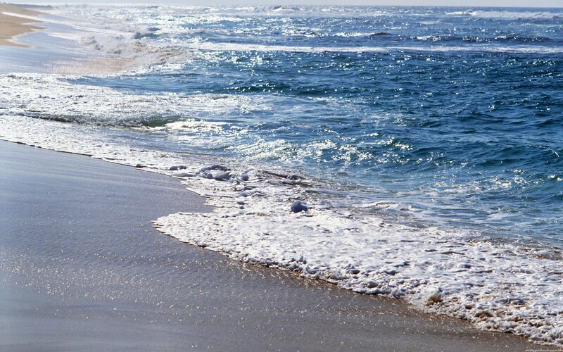 Ocean waves on sandy beach
