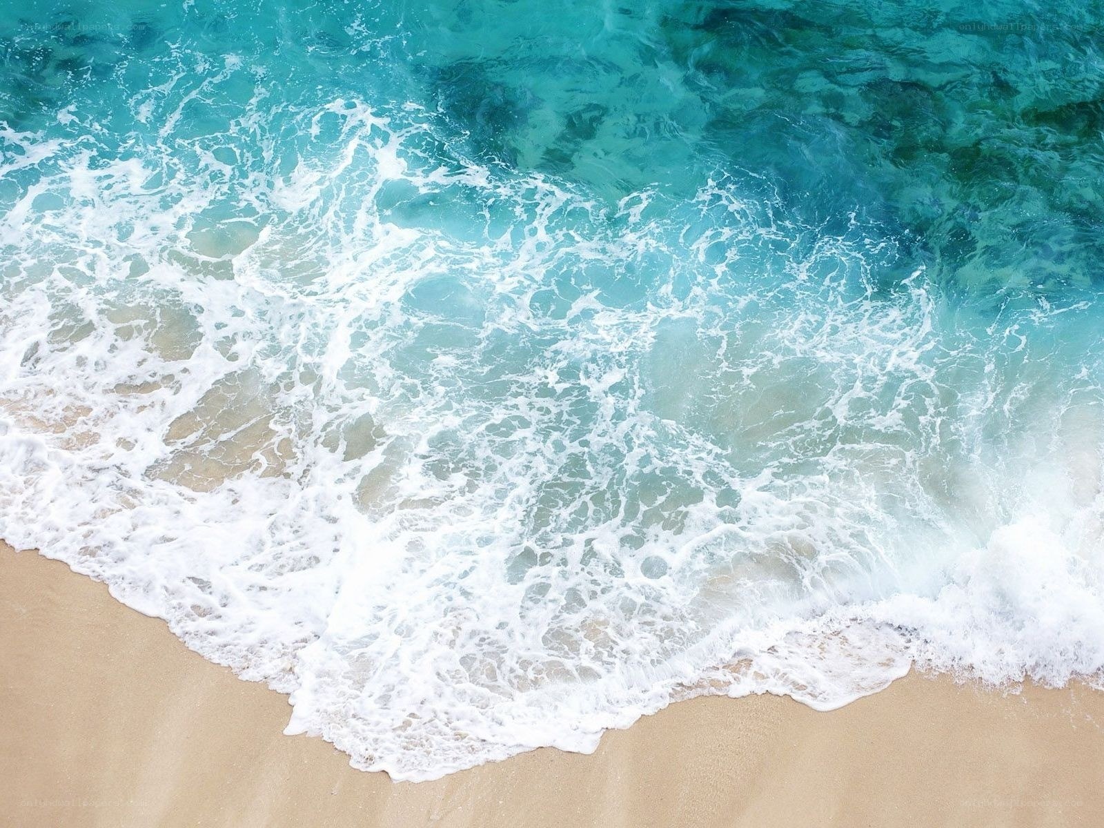 ocean waves on sandy beach