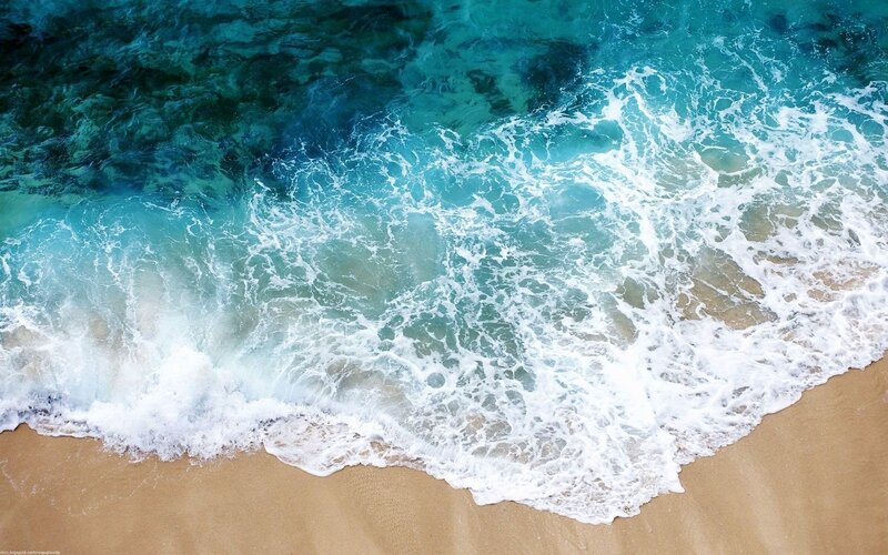ocean waves on sandy beach