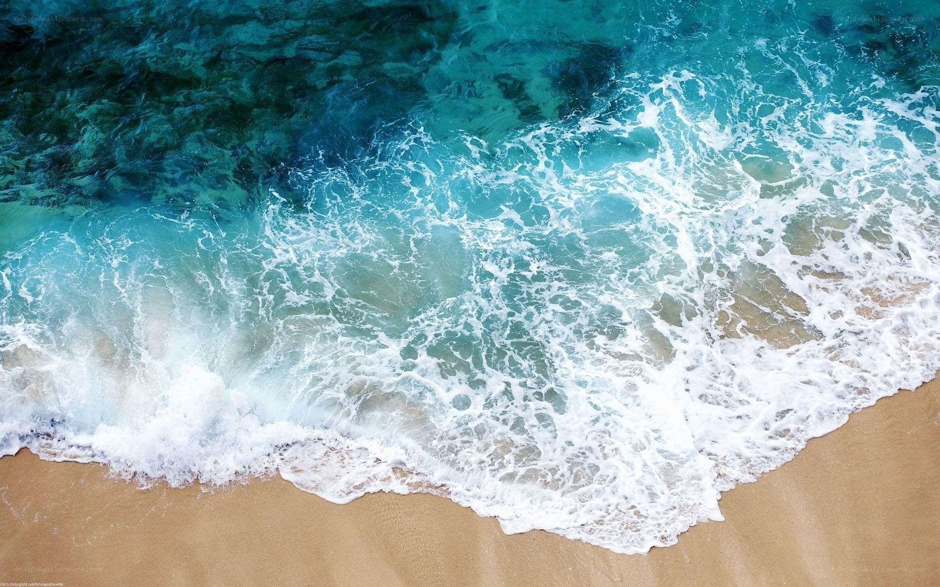 ocean waves on sandy beach