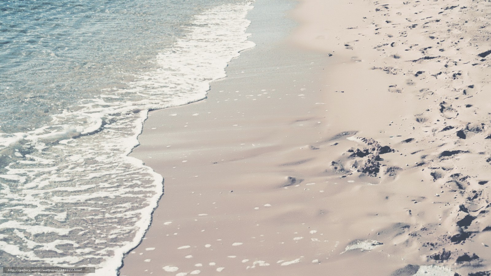 Ocean waves on sandy beach