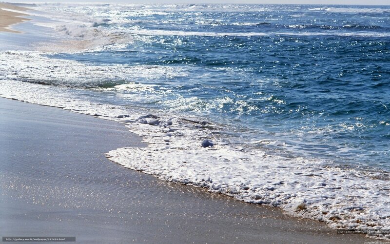 Ocean waves on sandy beach