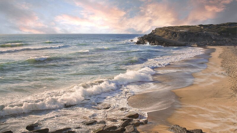 Ocean Waves on Sandy Beach — Blue, Serene, Sunset, Photograph, Cliff