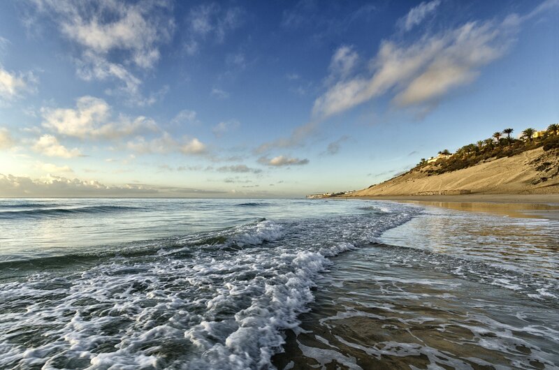 Ocean Waves on Sandy Beach — Blue, Serene, Sunset, Photograph, Sky