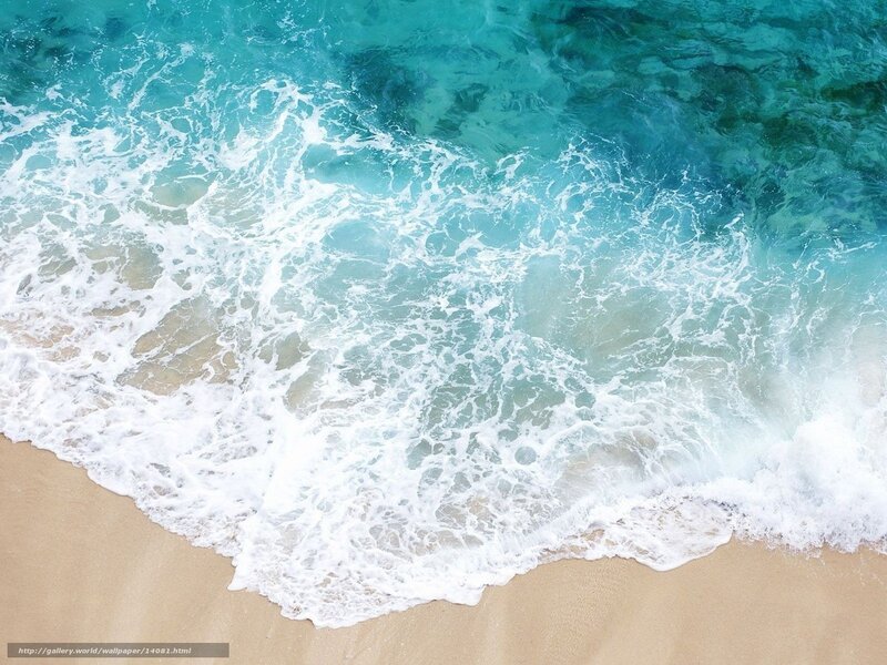 Ocean waves on sandy beach