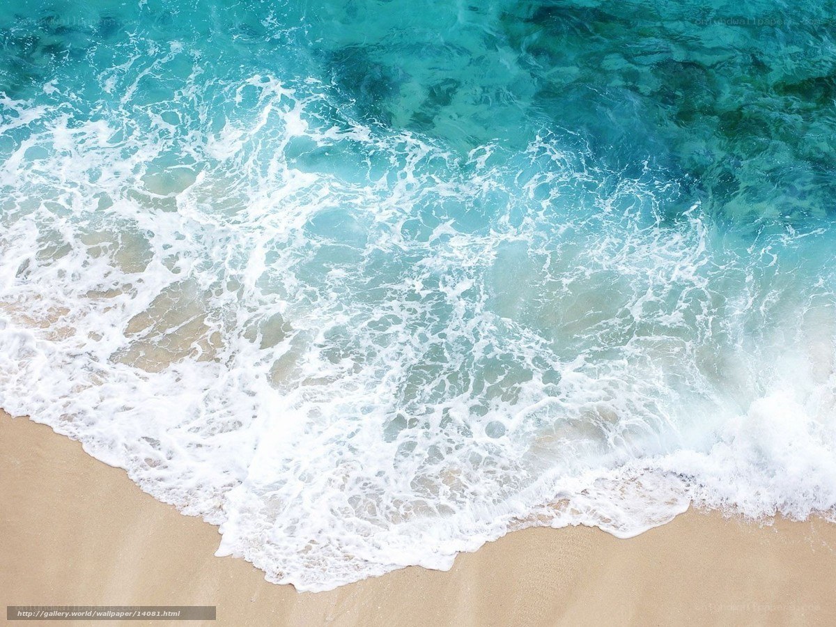 Ocean waves on sandy beach