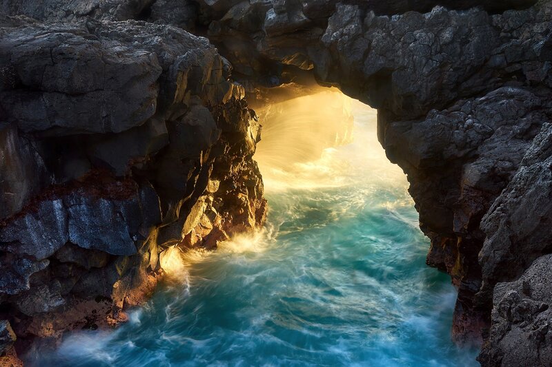 Ocean Waves Through Rock Arch — Blue