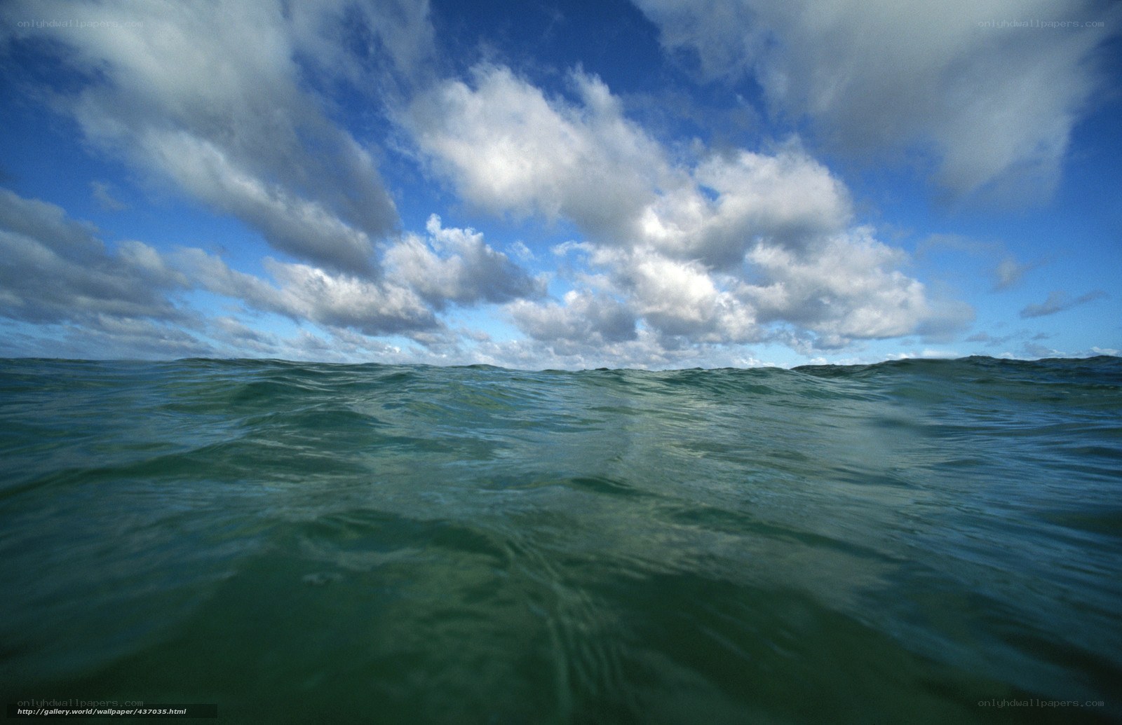 ocean waves under cloudy sky