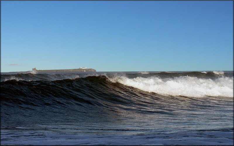 Ocean waves with distant island