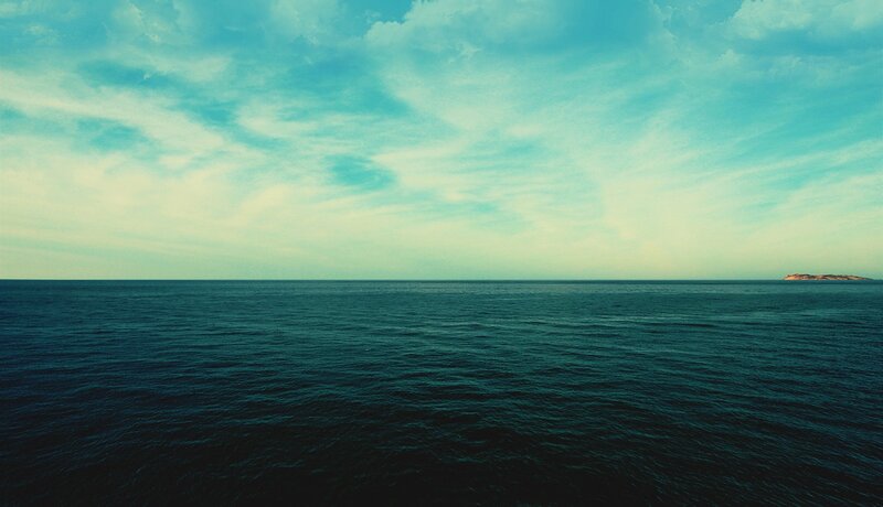 Ocean with Distant Island — Blue, Serene, Afternoon, Photograph, Sky, Clouds, Teal, Green