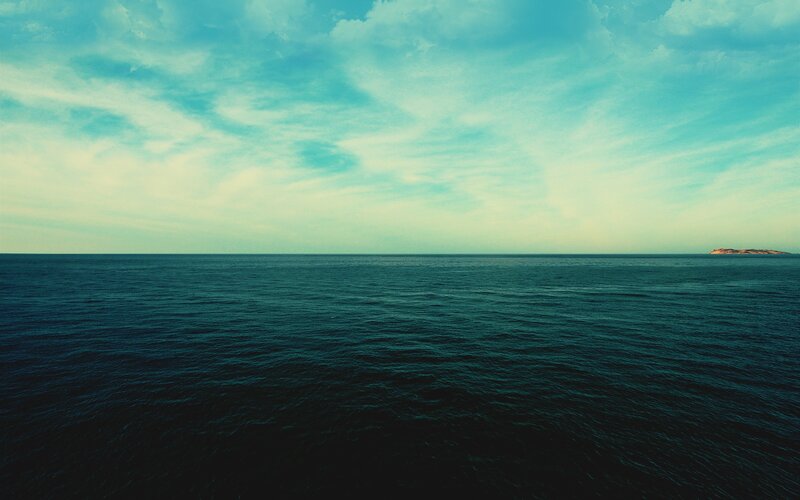 Ocean with Distant Island — Blue, Serene, Afternoon