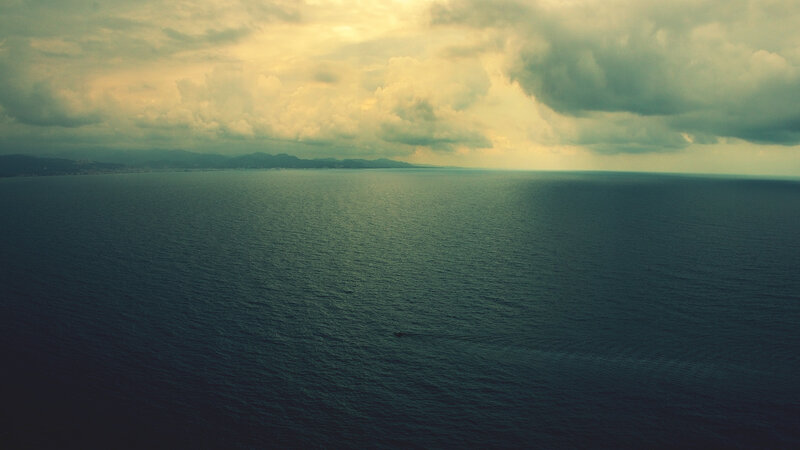 Ocean with Distant Land — Blue, Dramatic, Afternoon, Photograph, Clouds